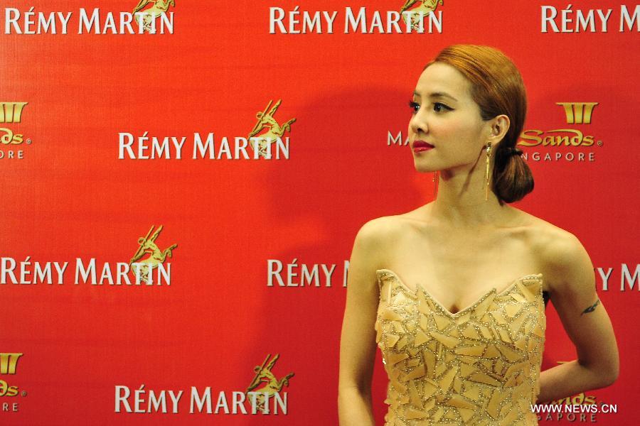 Singer Jolin Tsai attends the Remy Martin Centaur Dance competition as a judge in Singapore on Jan. 18, 2013. The final round of the Remy Martin Centaur Dance competition was held in the Marina Bay Sands Expo and Convention hall of Singapore on Friday. (Xinhua/Then Chih Wey) 
