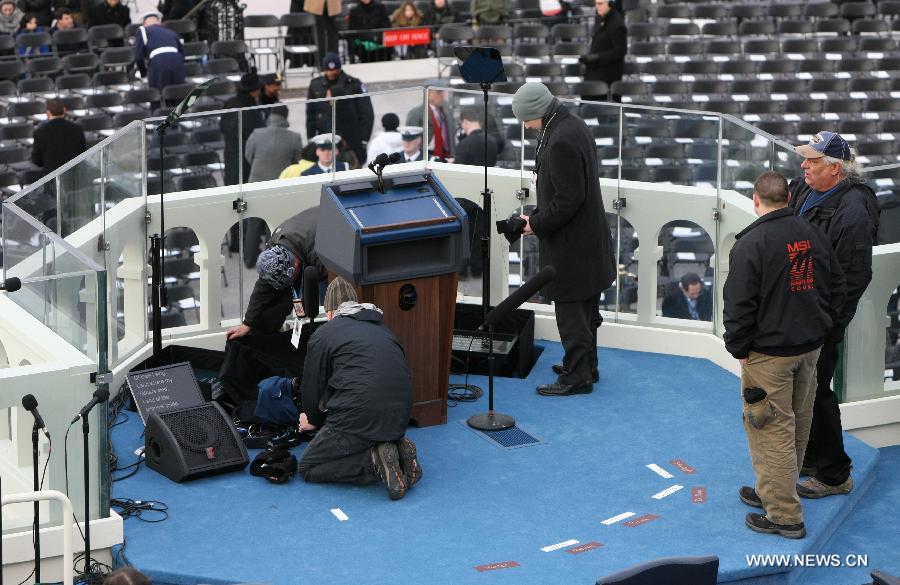 Staff members get the platform prepared before President Barack Obama's inauguration ceremony on the West Front of the U.S. Capitol in Washington, DC, the U.S., on Jan. 21, 2013. (Xinhua/Fang Zhe)