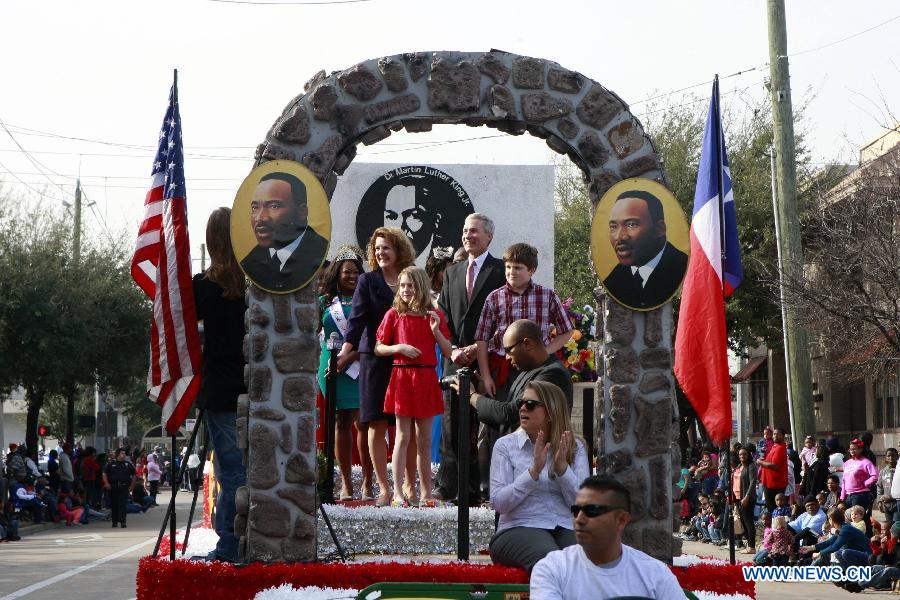 People take part in the Martin Luther King Parade in Houston, the United States, on Jan. 21, 2013. (Xinhua/Song Qiong) 