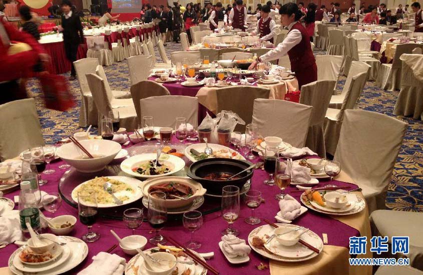 A state-own enterprise held a celebrating party in a five-star restaurant on Jan 20, 2013. More than 70 dinner tables are organized with each costing of 3900 yuan per table. And lots food left over after party and no one takes away. (Photo/Xinhua)
