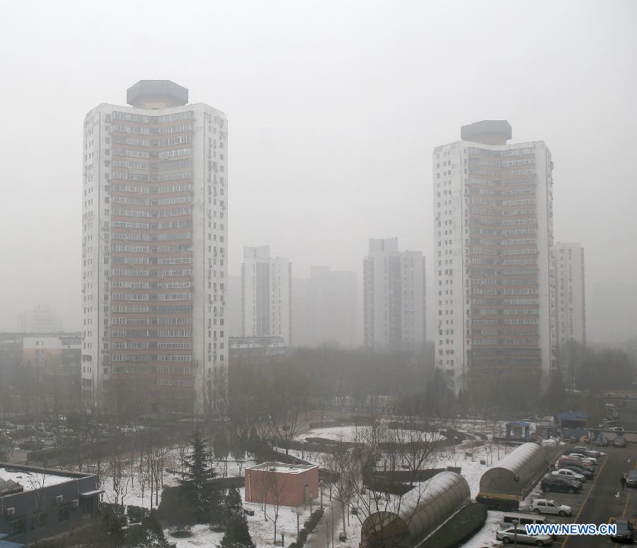 Buildings are seen in fog-enveloped Beijing, capital of China, Jan. 23, 2013. The air quality hit the level of serious pollution in Beijing on Wednesday, as smog blanketed the city. (Xinhua/Wan Xiang) 