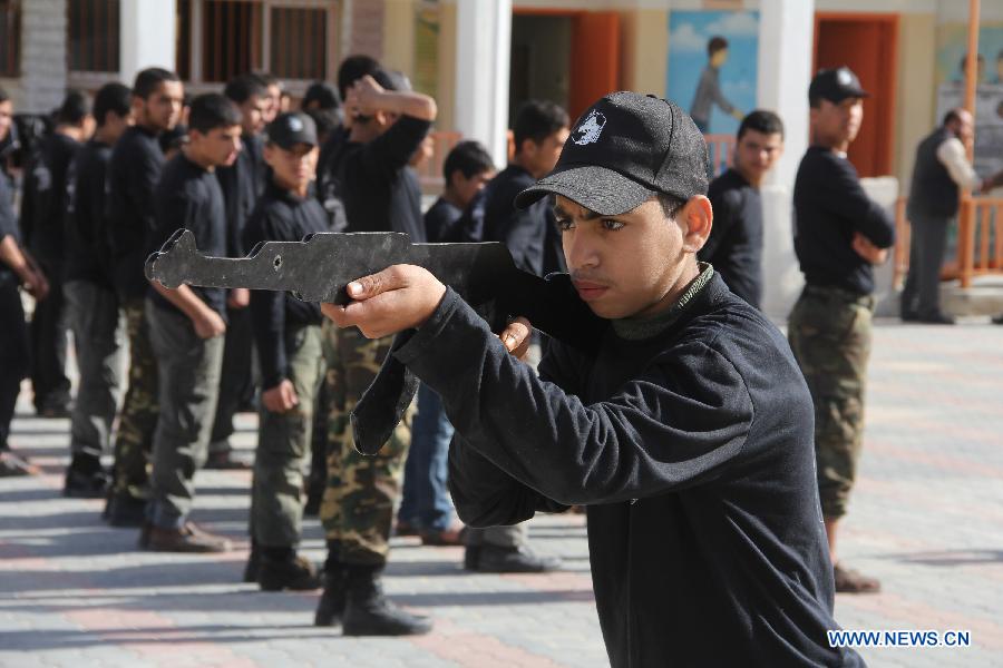 Palestinian students take part in a paramilitary training organized by Hamas National Security in the southern Gaza Strip city of Rafah on Jan. 23, 2013. (Xinhua/Khaled Omar) 