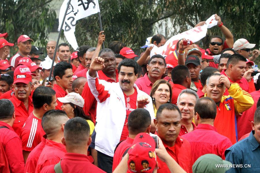 Venezuelan Vice President Nicolas Maduro (C) attends a rally to commemorate the 55th anniversary of democracy, in Caracas, capital of Venezuela, on Jan. 23, 2013. (Xinhua/Zurimar Campos/AVN) 