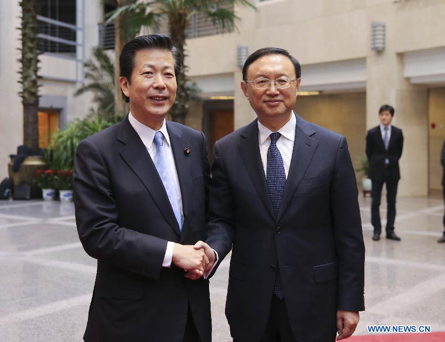 Chinese Foreign Minister Yang Jiechi (R) shakes hands with Natsuo Yamaguchi, leader of the New Komeito party, the smaller of Japan's two ruling parties, in Beijing, capital of China, Jan. 24, 2013. (Xinhua/Ding Lin)