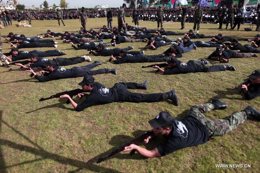 Palestinian high school students show their skills during a graduation ceremony of a military school course organized by the Hamas security forces and the Hamas Minister of Education in Gaza City, on Jan. 24, 2013. (Xinhua/Wissam Nassar)  