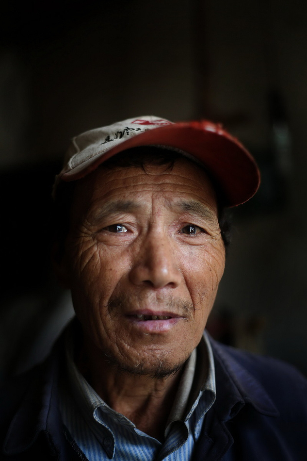 Zhu Chaoping, 70, lives in Luquan county.(Photo/Eastday)