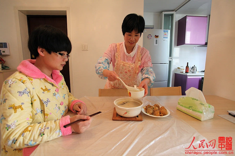 Zhang is happy to hear the puerperal praises her cooking.