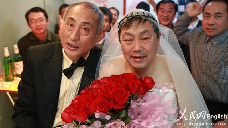 With the witness of several supporters, a special wedding ceremony for two old men is held in Pinggu district of Beijing, Jan. 30. Recently, a pair of old men, a retired teacher and a bottled water deliveryman, announced their engagement and became a hotly debated topic in China. (Photo/CFP)