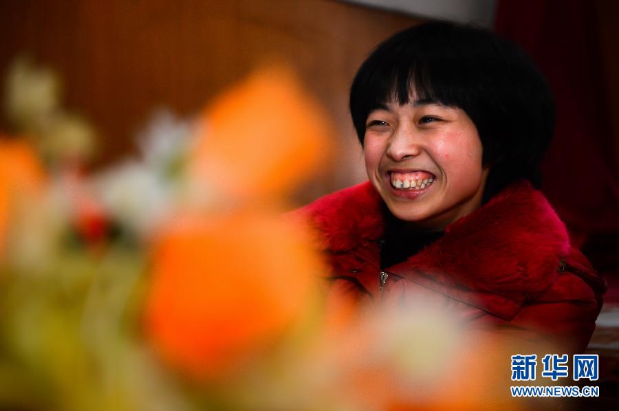 Photo taken on Jan 25, 2013 shows Liu Xiaolin with a big smile (Xinhua/Guo Xulei)