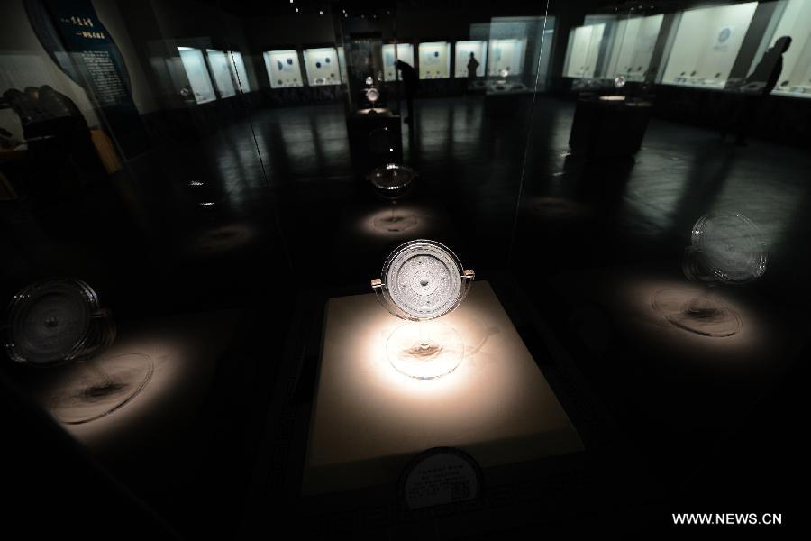 Photo taken on Feb. 2, 2013 shows a bronze mirror during an ancient bronze mirror exhibition in Hefei, capital of east China's Anhui Province. The exhibition, displaying a total of 153 bronze mirrors, opened here Saturday. (Xinhua/Zhang Duan)