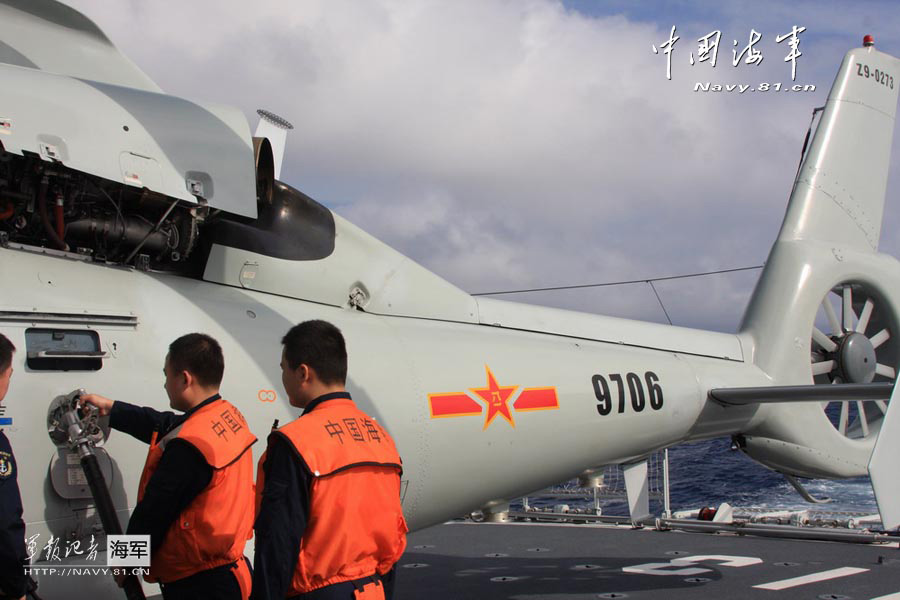 The joint maneuvering ship formation of the North Sea Fleet of the Navy of the Chinese People's Liberation Army (PLA) conducted an antisubmarine training with the guide of ship-borne helicopter in a sea area. (China Military Online/Ding Zengyi and Wang Lingshuo)