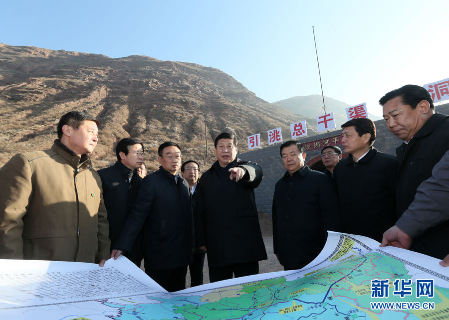Xi Jinping (C), general secretary of the Central Committee of the Communist Party of China (CPC) and also chairman of the CPC Central Military Commission, visits a major water diversion project in the Weiyuan County of Dingxi City, northwest China's Gansu Province, Feb. 3, 2013.