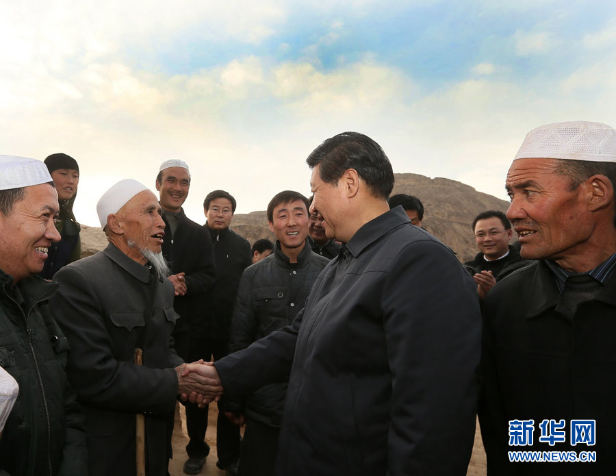 Xi Jinping, general secretary of the Central Committee of the Communist Party of China (CPC) and also chairman of the CPC Central Military Commission, shakes hands with villagers in the Bulenggou Village of the Dongxiang Autonomous County, northwest China's Gansu Province, Feb. 3, 2013. Xi Jinping visited villages, enterprises and urban communities, chatting with impoverished villagers and asking about their livelihood during an inspection tour to Gansu from Feb. 2 to 5. During his visit, Xi also extended Spring Festival greetings to all Chinese people as the Spring Festival, or the Chinese Lunar New Year, approaches. (Xinhua/Lan Hongguang)