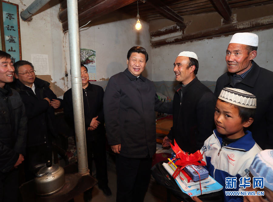 Xi Jinping (C), general secretary of the Central Committee of the Communist Party of China (CPC) and also chairman of the CPC Central Military Commission, visits the home of impoverished villager Ma Maizhi and presents school supplies to Ma's children in the Bulenggou Village of the Dongxiang Autonomous County, northwest China's Gansu Province, Feb. 3, 2013. Xi Jinping visited villages, enterprises and urban communities, chatting with impoverished villagers and asking about their livelihood during an inspection tour to Gansu from Feb. 2 to 5. During his visit, Xi also extended Spring Festival greetings to all Chinese people as the Spring Festival, or the Chinese Lunar New Year, approaches. (Xinhua/Lan Hongguang)