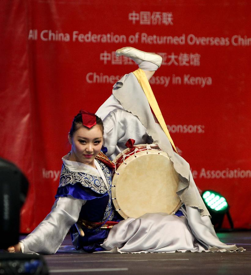 Dancer Lin Lihua performs during the performances of the Embrace China Art Group of the All-China Federation of Returned Overseas Chinese in Nairobi, Kenya, Feb. 16, 2013. (Xinhua/Meng Chenguang) 