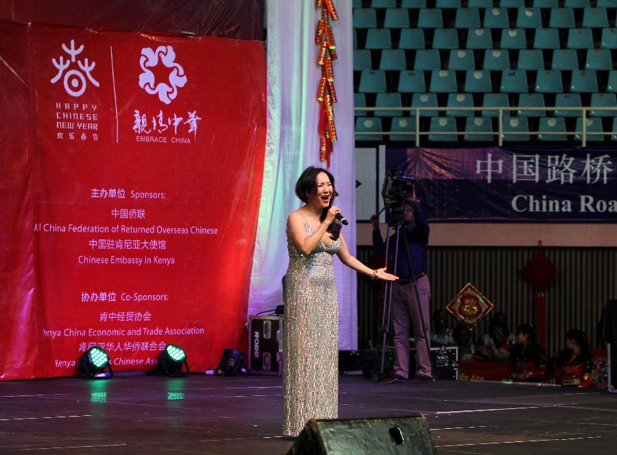 Chinese singer Zheng Xulan performs during the performances of the Embrace China Art Group of the All-China Federation of Returned Overseas Chinese in Nairobi, Kenya, Feb. 16, 2013. (Xinhua/Meng Chenguang) 