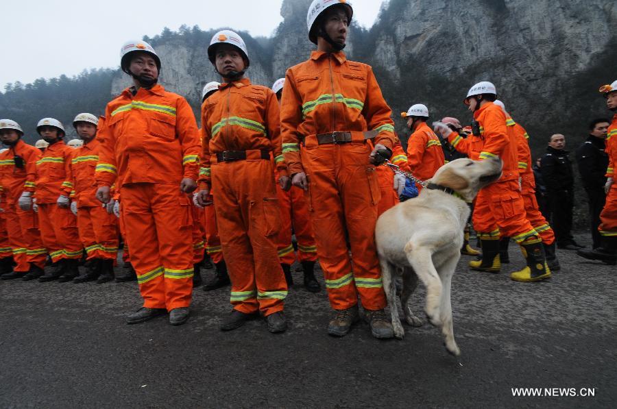 Rescuers prepare to search for survivors of a landslide accident in Longchang Township in the city of Kaili, southwest China's Guizhou Province, Feb. 18, 2013. Initial investigation has found that five people, including two children, were buried after a landslide hit southwest China's Guizhou Province on Monday morning. The landslide happened around 11 a.m. in Longchang Township, burying six work sheds. (Photo/Xinhua) 