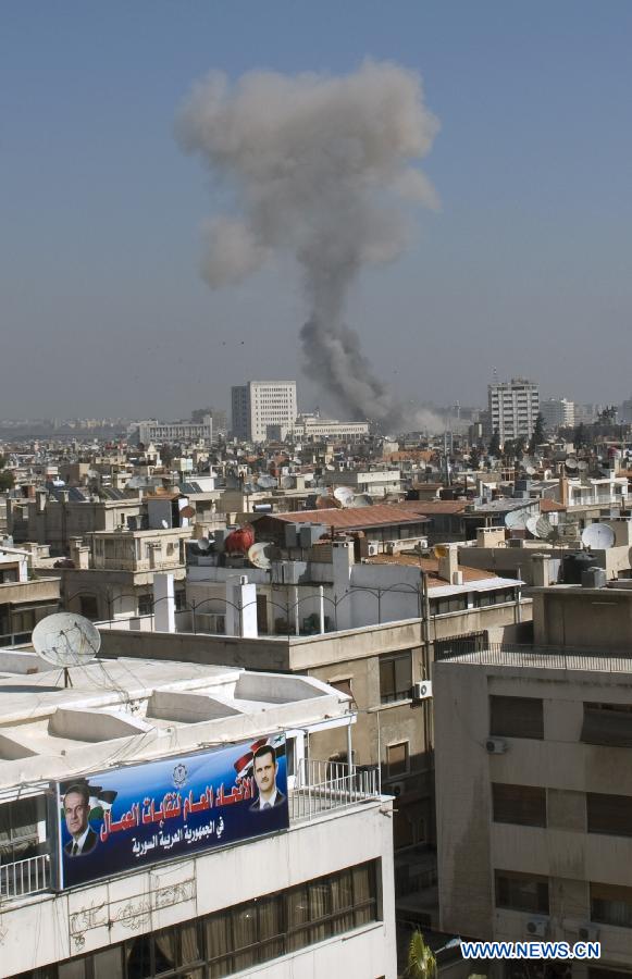 Smoke is seen billowing over the city center after a big blast rattled al-Thawra Street in central Damascus, Syria, Feb. 21, 2013. (Xinhua/Bassem Tllawi) 