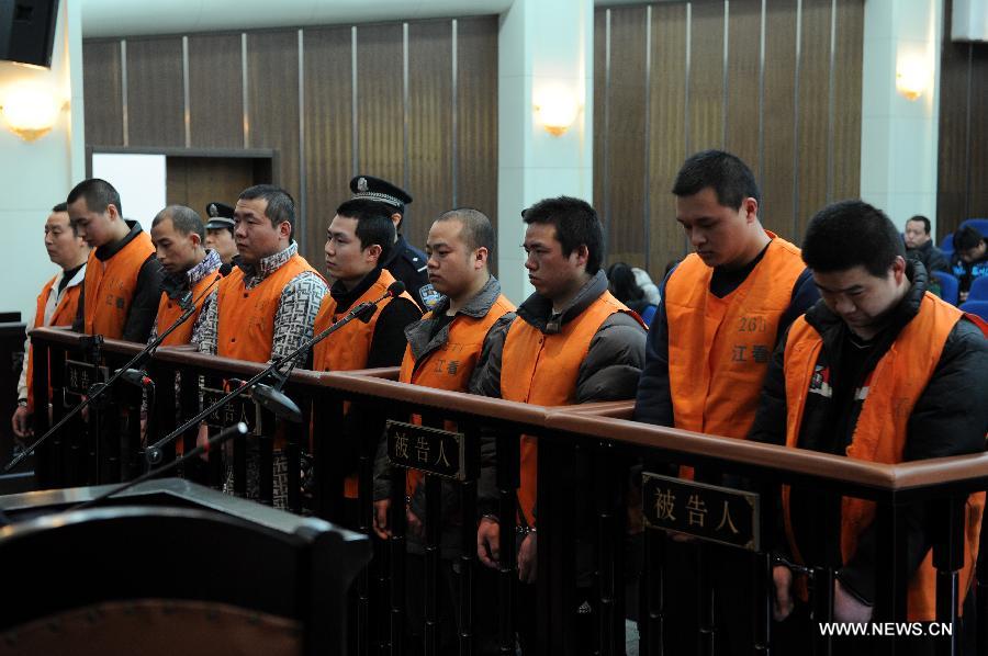 Defendants stand trial over kidney trafficking at the People's Court of Jianggan District in Hangzhou, capital of east China's Zhejiang Province, Feb. 21, 2013. Nine people, all under the age of 30, stood trial on Feb. 21 for kidney trafficking here. They recruited people who were willing to sell their kidneys and the kidney trafficking ring had recruited 38 people, 11 of whom sold their kidneys before the case was cracked by the Hangzhou police in May 2012. Traffickers could earn between 20,000 and 30,000 yuan (4,805 U.S. dollars) for each kidney. The nine should be prosecuted for the crime of organizing human organ trafficking, according to the procuratorate. The court will sentence the nine at a later date. (Xinhua/Ju Huanzong) 
