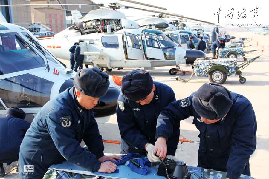 A carrier-based aircraft regiment under the Navy of the Chinese People's Liberation Army (PLA) conducts flight training after the Spring Festival on February 19, 2013. They not only completed the flight training subjects, but also made comprehensive maintenance and inspection to the airfield road, support vehicles, and the communication facilities. (navy.81.cn/Hu Baoliang, Zhang Wei, Zhang Yinjie)