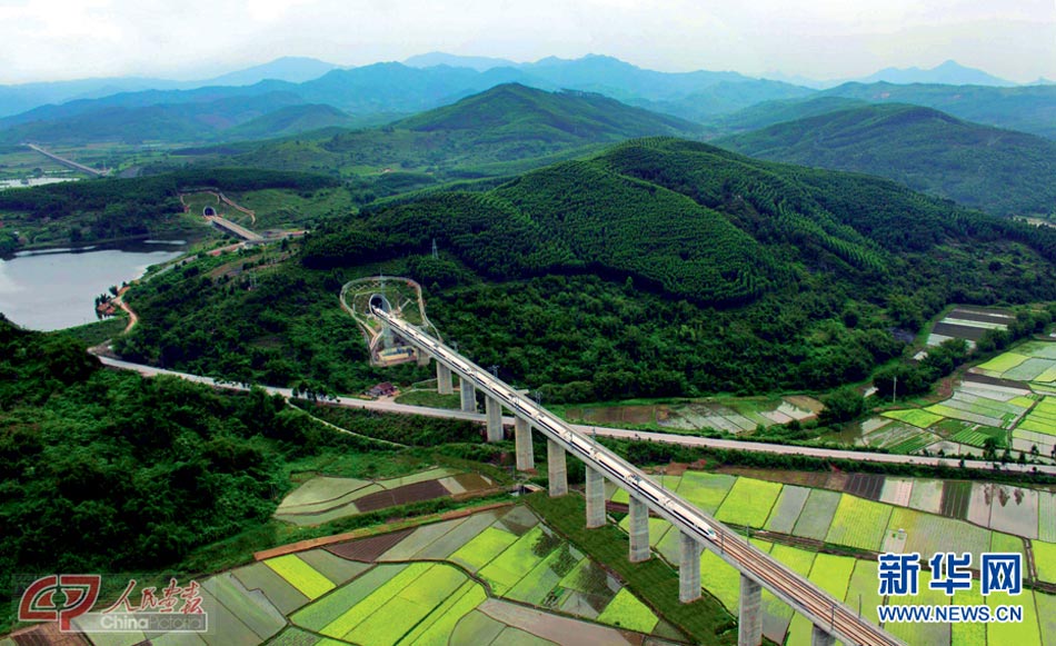 A high-speed train runs through the mountains in south China. (Photo/Xinhua)