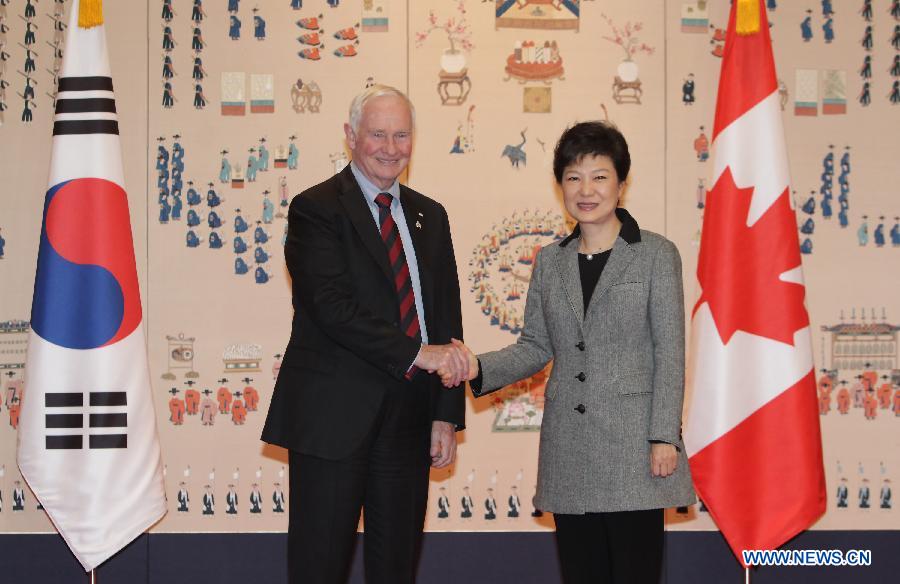South Korea's newly sworn-in President Park Geun-hye (R) shakes hands with Canadian Governor General David Johnston ahead of their meeting at the presidential house in Seoul, South Korea, Feb. 26, 2013. Park Geun-hye was sworn in Monday as South Korea's first female president, kicking off a five-year term in the top job. (Xinhua) 