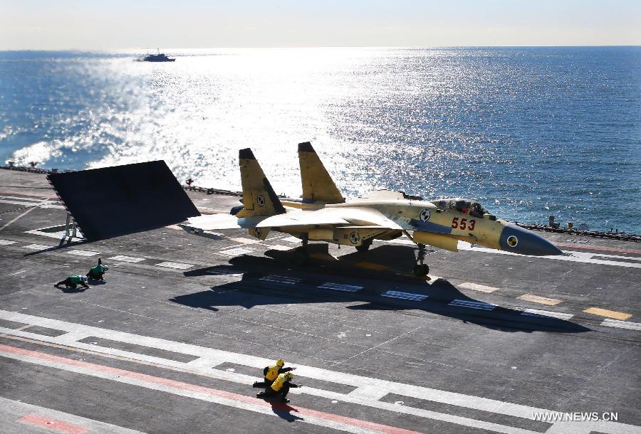 This undated photo shows a carrier-borne J-15 fighter jet ready to take off from China's first aircraft carrier, the Liaoning.  (Xinhua File Photo/Zha Chunming) 