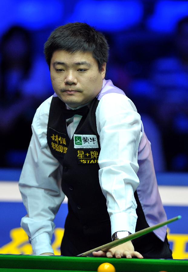 Ding Junhui of China reacts during the first round match against Michael Holt of England at the Haikou World Open snooker tournament in Haikou, capital of south China's Hainan Province, Feb. 27, 2013. Ding Junhui won 5-4. (Xinhua/Guo Cheng)