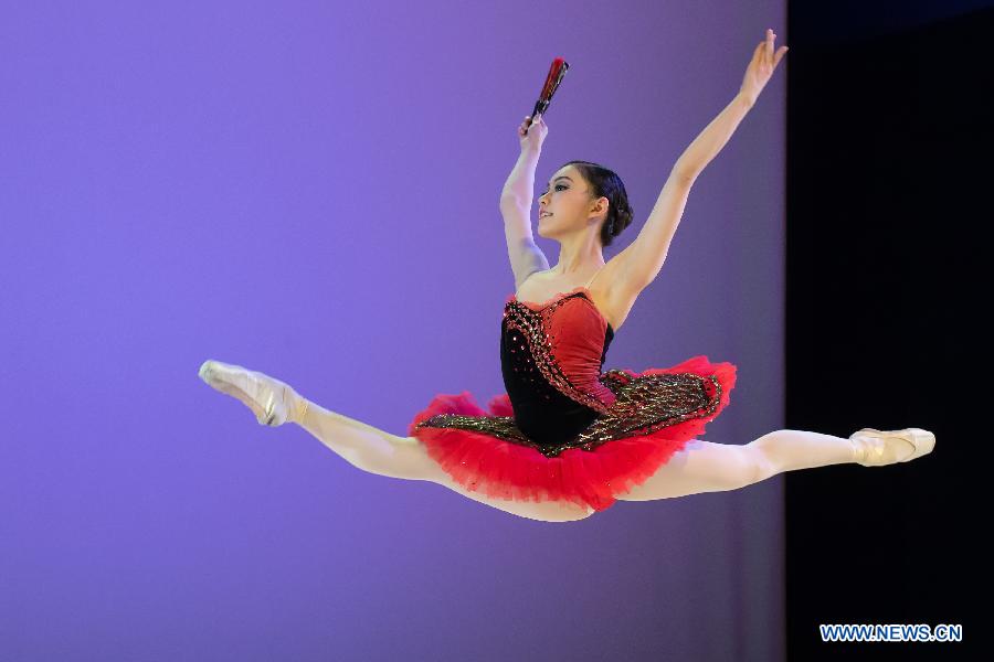 A student of the Hungarian Dance Academy performs on stage in the National Dance Theatre in Budapest, Hungary, on Feb. 27, 2013. (Xinhua/Attila Volgyi) 