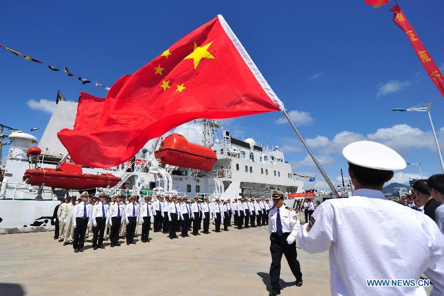 Marine patrol staff members get ready to conduct a coast guard mission at the port of Sanya, south China's Hainan Province, Feb. 28, 2013. A formation of three marine patrol ships "Haixun 21", "Haixun 31" and "Haixun 166" started their coast guard mission in South China Sea on Thursday, a second one by the national Maritime Safety Administration at this water area in 2013. The first mission was conducted from Jan. 15, 2013 to Jan. 17, 2013. (Xinhua/Hou Jiansen) 