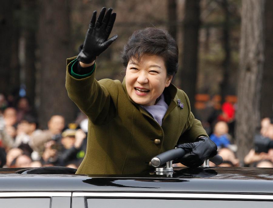 South Korea's new president Park Geun-hye waves after her inauguration ceremony at parliament in Seoul. Park was sworn in as the country's first female president on February 25, 2013.  (Xinhua/AFP Photo)