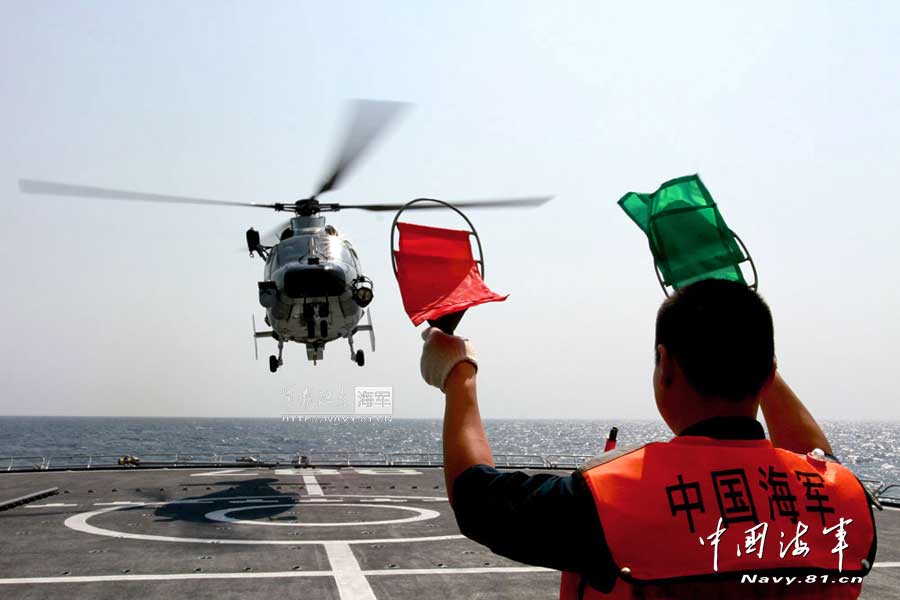 The 14th escort taskforce under the Navy of the Chinese People's Liberation Army (PLA) organizes taking off and landing training for its two ship-borne helicopters aboard the Harbin guided missile destroyer, the Mianyang guided missile frigate and the Weishan Lake comprehensive supply ship. (navy.81.cn/Dong Xiguang, Li Ding, Yang Qinghai, Yang Shangjun, Zhang Mingxing)