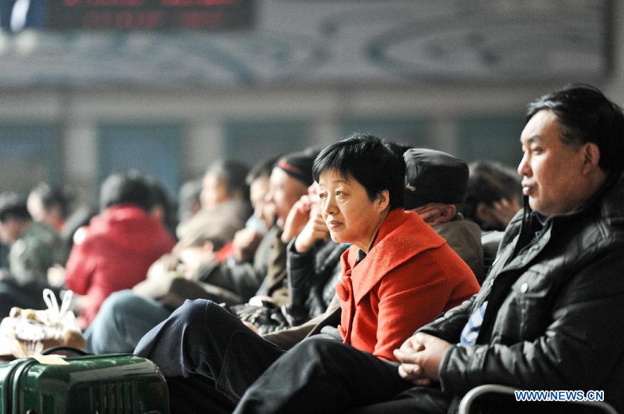 Passengers are seen at a waiting hall at the railway station in Harbin, capital of northeast China's Heilongjiang Province, March 6, 2013. The 40-day Spring Festival travel rush, started on Jan. 26 this year, came to the last day on Wednesday. The Spring Festival, which falls on Feb. 10 this year, is traditionally the most important holiday of the Chinese people. It is a custom for families to reunite in the holiday, a factor that has led to massive seasonal travel rushes in recent years as more Chinese leave their hometowns to seek work elsewhere. (Xinhua/Wang Song) 