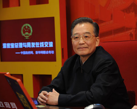 Chinese Premier Wen Jiabao prepares to chat with Internet surfers on two state news portals in Beijing, China, Feb. 28, 2009. (Xinhua File Photo)