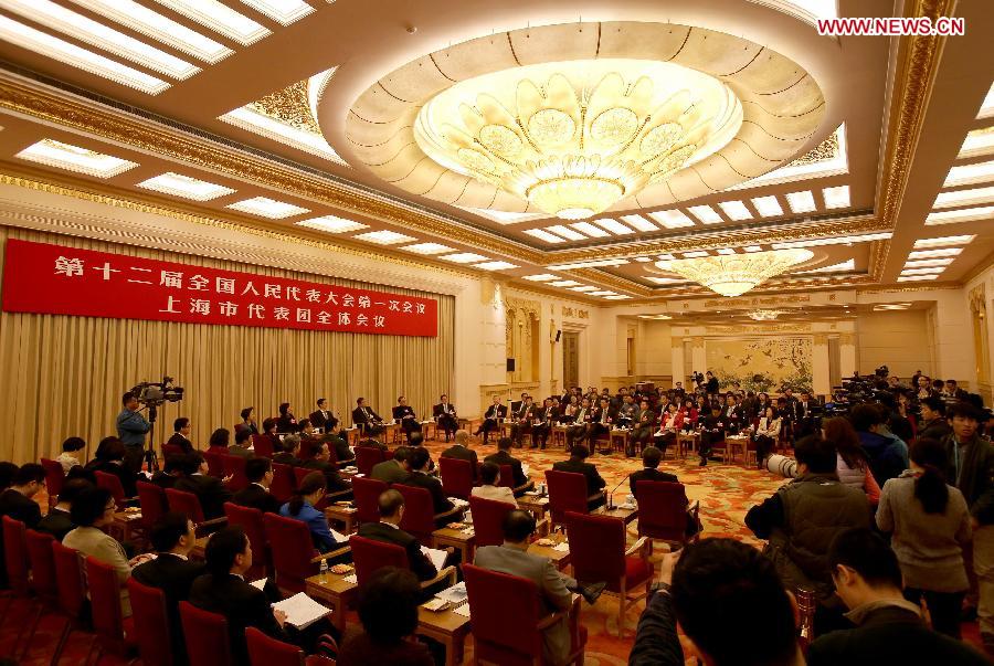 Deputies to the 12th National People's Congress (NPC) from east China's Shanghai take part in a discussion in Beijing, capital of China, March 6, 2013. The discussion which was held by the Shanghai delegation to the first session of the 12th NPC was open to media on Wednesday. (Xinhua/Jin Liwang)