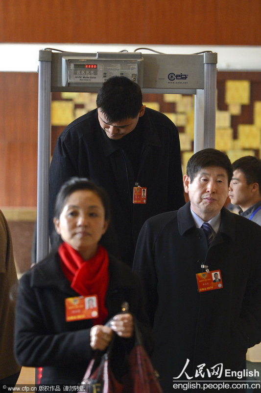 Yao Ming passes through the security on March 2, 2013 in Beijing. (Photo/CFP)