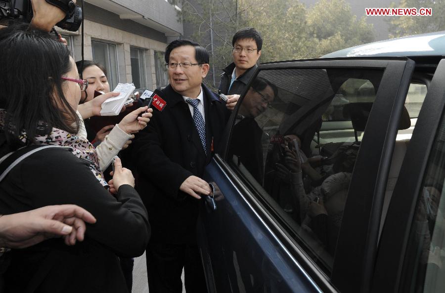Wan Gang, the minister of science and technology, receives an interview before taking an electric vehicle (EV) to leave after a panel discussion in Beijing, capital of China, March 7, 2013. The minister said to reporters that zero-emission electric vehicles had been sold in Chinese market with an affordable price. (Xinhua/Zhang Duo)