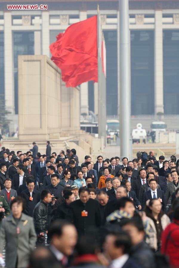 Members of the 12th National Committee of the Chinese People's Political Consultative Conference (CPPCC) arrive at the Tian'anmen Square in Beijing, capital of China, March 11, 2013. The fourth plenary meeting of the first session of the 12th CPPCC National Committee is to be held in Beijing Monday afternoon, at which chairman, vice-chairpersons, secretary-general and Standing Committee members of the 12th CPPCC National Committee will be elected. (Xinhua/Wang Shen)