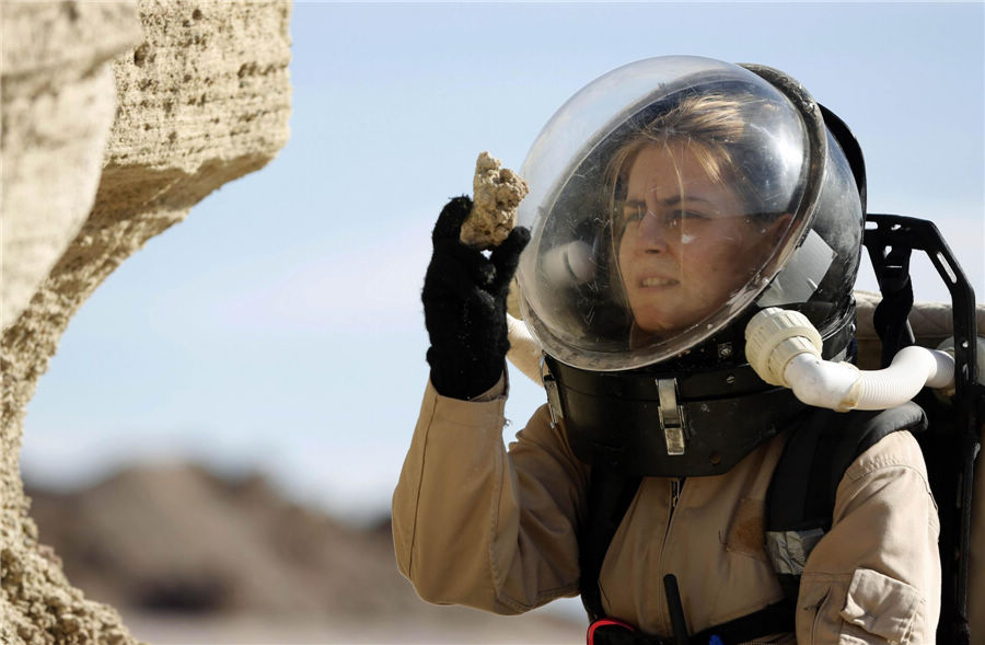 Csilla Orgel, a geologist with Crew 125 EuroMoonMars B mission, collects geologic samples for study at the Mars Desert Research Station (MDRS) outside Hanksville in the Utah desert March 2, 2013. (Photo/Agencies)