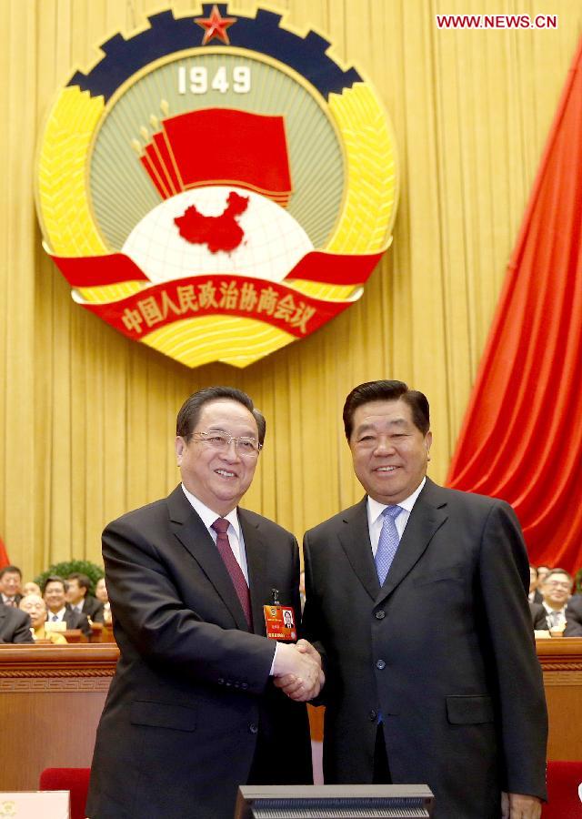 The 4th plenary meeting of 1st session of 12th CPPCC National Committee opens on March 11. At the meeting Yu Zhengsheng was elected chairman of the National Committee of the Chinese People's Political Consultative Conference (CPPCC), the top political advisory body. Photo shows that Jia Qinglin (R), chairman of the 11th National Committee of the Chinese People's Political Consultative Conference (CPPCC), congratulates Yu Zhengsheng after the election. (China.org.cn/ Yang Jia)