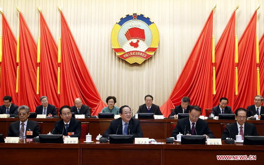 Yu Zhengsheng (C front), a member of the Standing Committee of the Political Bureau of the Communist Party of China (CPC) Central Committee, who is also chairman of the 12th National Committee of the Chinese People's Political Consultative Conference (CPPCC), presides over the closing meeting of the first conference of the Standing Committee of the 12th CPPCC National Committee in Beijing, capital of China, March 13, 2013. (Xinhua/Ju Peng) 