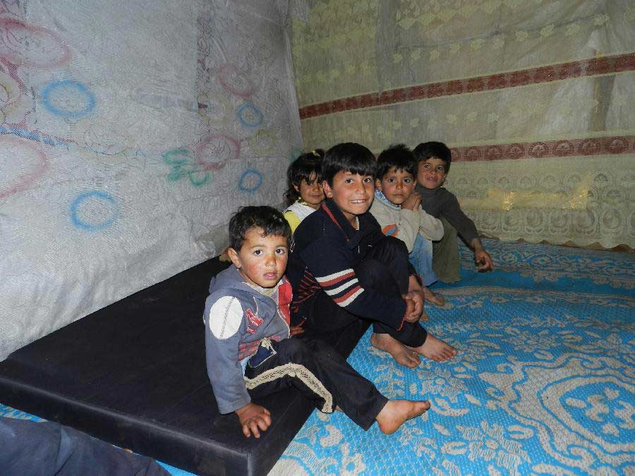 Syrian refugee children are seen in a camp at a town in south Lebanon, March 18, 2013. The UN High Commissioner for Refugees (UNHCR) said Friday that the number of Syrian refugees in Lebanon has reached to 357,000. (Xinhua)
