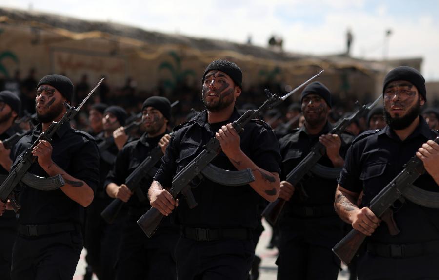 Palestinian police officers show their skills during their graduation ceremony at the police academy in Gaza City, on March 19, 2013. (Xinhua/Wissam Nassar)
