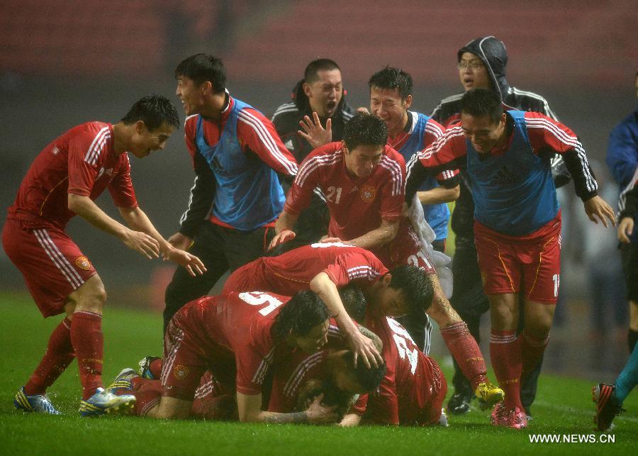 Players of the Chinese team celebrate after scoring during the 2015 AFC Asian Cup qualifier football match between China and Iraq in Changsha, capital of central China's Hunan Province, March 22, 2013. China won 1-0. (Xinhua/Guo Yong) 