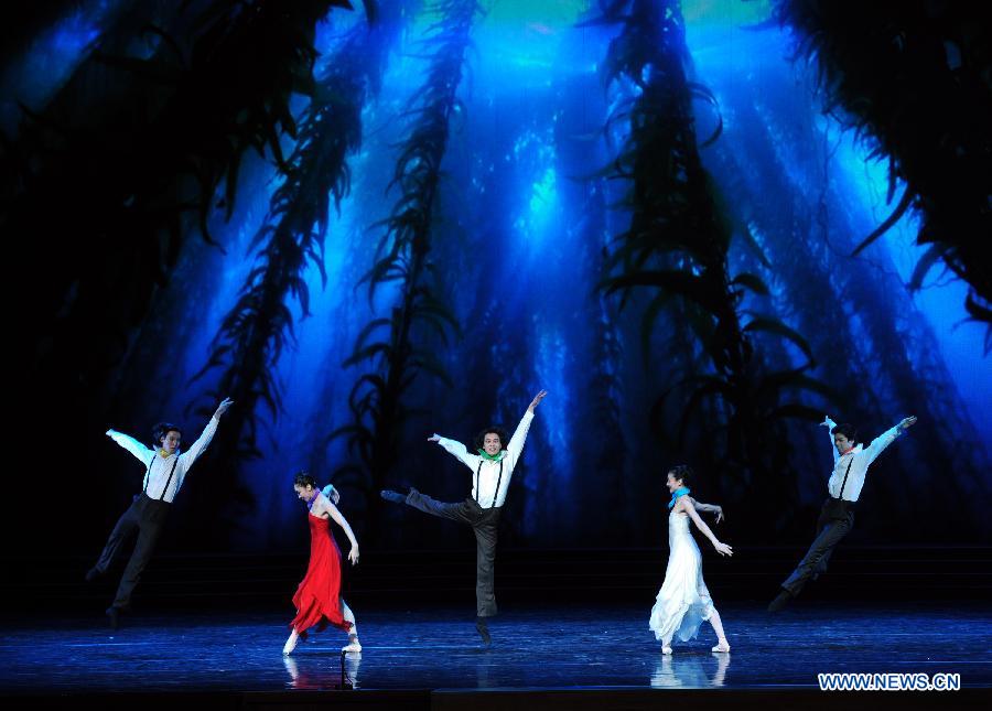 Artists perform during the opening ceremony of the "Tourism Year of China" in Moscow, March 22, 2013. The "China-Russia Tourism Year" program, which began last year with the "Tourism Year of Russia" in China, aims to foster tourism ties and humanistic exchanges between the two countries. (Xinhua/Jiang Kehong)