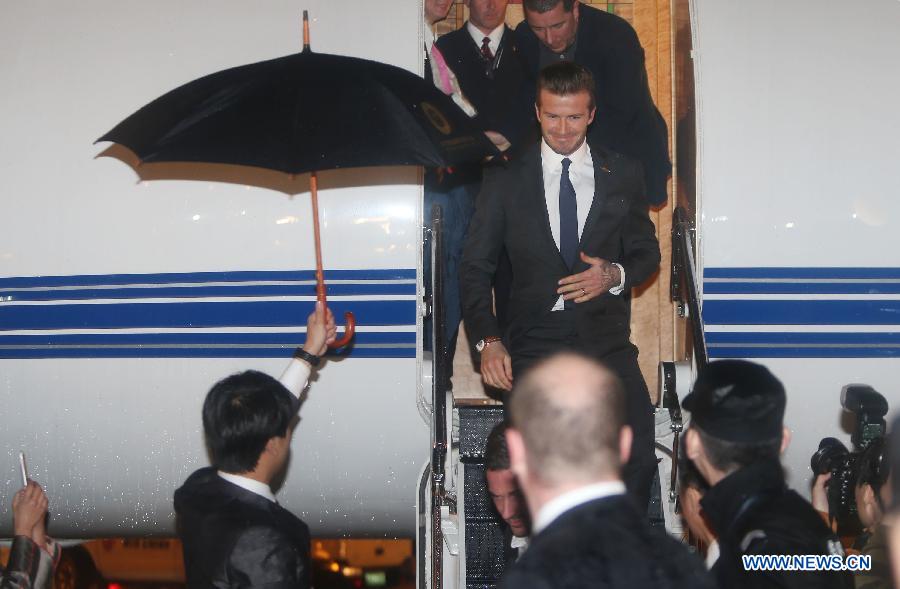 Football superstar David Beckham receives warm welcome as he arrives in Wuhan, capital of central China's Hubei Province, as the ambassador for the Chinese Super League (CSL) and the Youth Football Program, March 22, 2013. (Xinhua) 