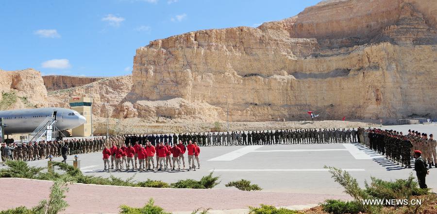 Participants attend the opening ceremony of the Fifth Warrior Competition in King Abdullah Special Operation Training Center (KASOTC) in Amman, Jordan, March 24, 2013. The competition with wide participation of 33 teams from 18 countries will be held during March 24 to March 28. (Xinhua/Cheng Chunxiang)