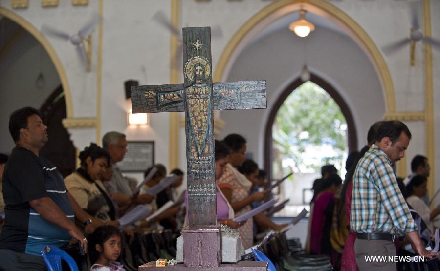 Indian Christians pray during Good Friday celebration at a church in Calcutta, capital of eastern Indian state West Bengal, March 29, 2013. Christians all over the world marked Good Friday, the day when Christ was crucified. (Xinhua/Tumpa Mondal) 