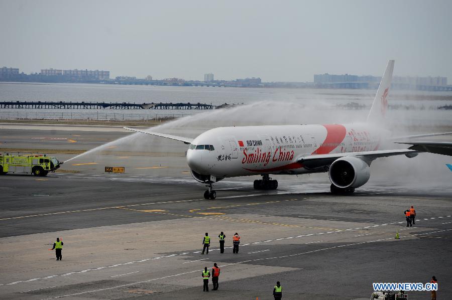 A Boeing 777-300ER flying from Beijing arrives at the John F. Kennedy International Airport in New York, March 31, 2013. Air China launched its second direct flight between Beijing and New York on Sunday, marking the company's biggest expansion in the U.S. There will be 11 flights plying between Beijing and New York each week and all of them are new Boeing 777-300ERs. (Xinhua/Wang Lei)