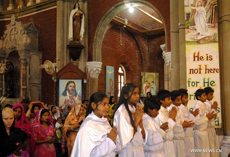 Pakistani Christians attend an Easter Mass at a church in eastern Pakistan's Lahore on March 31, 2013. Christians around the world are marking Easter Day, a Christian holiday to celebrate the resurrection of Jesus Christ on the third day of his crucifixion at Calvary as described in the New Testment. (Xinhua/Sajjad) 